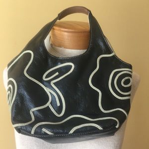 Black Nine West purse with taupe flowers